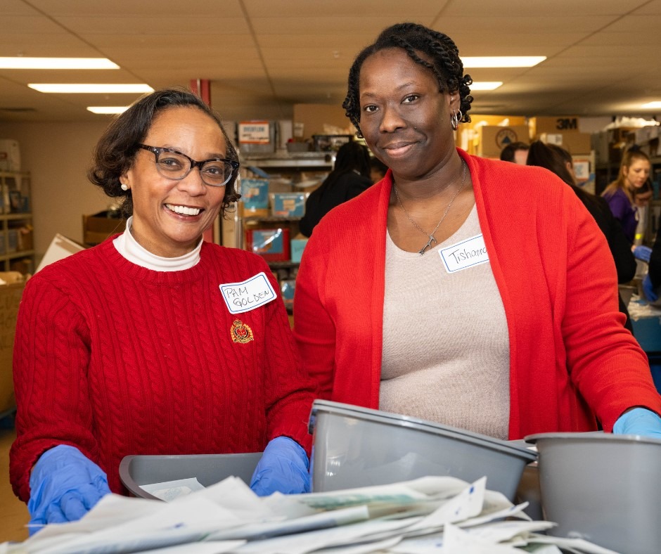 women sorting supplies at Global Links volunteer event