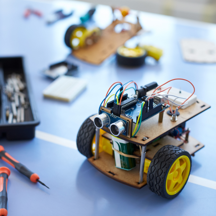 robotic vehicle with tools and parts near by