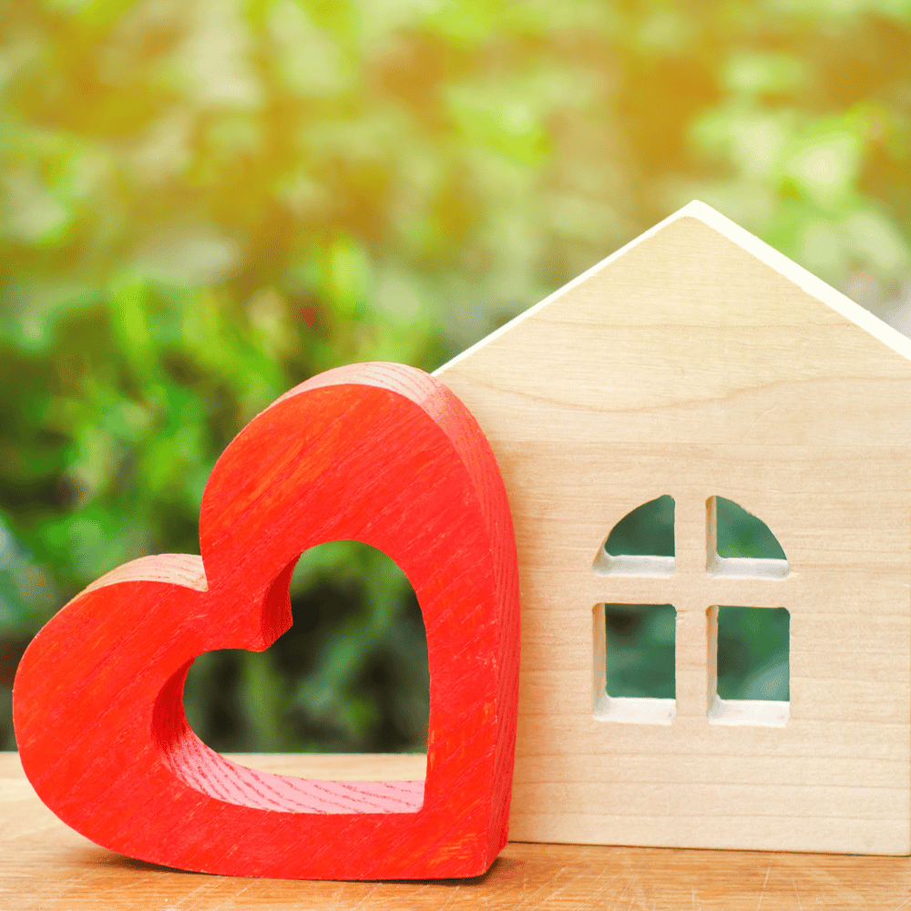 red heart with wood block house